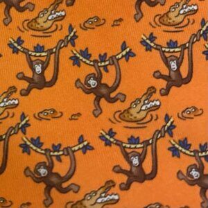 100% REAL RARE HERMES TIE - ORANGE MONKEY SWINGING ON VINES ABOVE GOLD CROCODILE